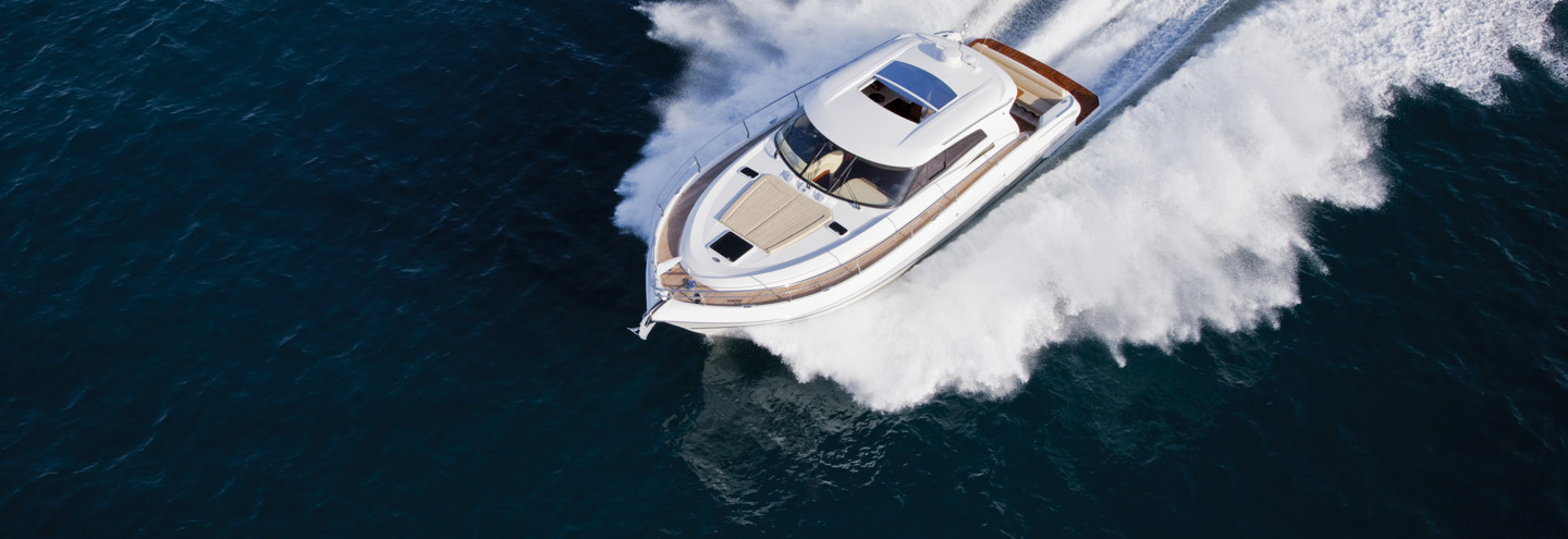 A luxurious yacht cruising through the sea on a sunny day