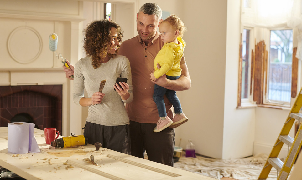 A young diy family getting good news by phone